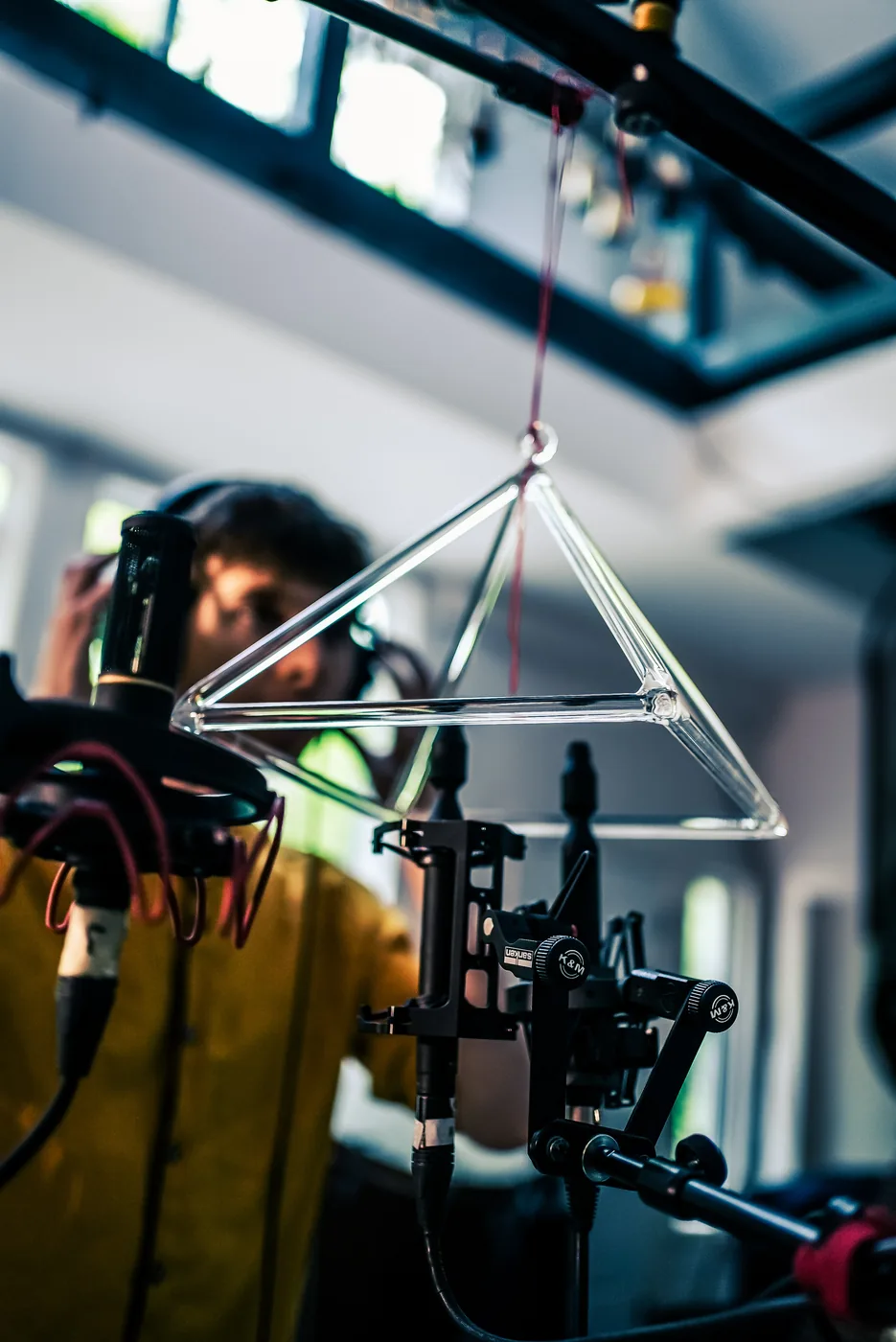 Glass singing pyramid under studio microphones